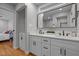 Bathroom features a double vanity, granite countertop, and updated fixtures at 5208 Melbourne Rd, Raleigh, NC 27606