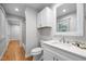 Bathroom featuring a single sink, vanity, commode, and shower-tub combination at 5208 Melbourne Rd, Raleigh, NC 27606