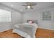 Bedroom features recessed lights, ceiling fan, and two large windows at 5208 Melbourne Rd, Raleigh, NC 27606