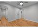 Bedroom with hardwood floors, a ceiling fan, and closets at 5208 Melbourne Rd, Raleigh, NC 27606