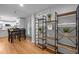 Open-concept living space features hardwood floors and view into the kitchen and dining area at 5208 Melbourne Rd, Raleigh, NC 27606