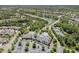 Aerial view featuring community clubhouse, parking lot, swimming pool, and surrounding neighborhood at 524 Clarenbridge Dr, Cary, NC 27519