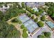 Aerial view of tennis courts, landscaping, and nearby community amenities at 524 Clarenbridge Dr, Cary, NC 27519