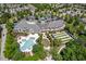 Aerial view of the community clubhouse with a large pool and bocce ball courts at 524 Clarenbridge Dr, Cary, NC 27519