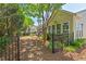 Lush backyard with decorative stone path leads to outdoor patio and dining set in a well-maintained yard at 524 Clarenbridge Dr, Cary, NC 27519