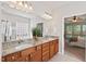 Bathroom features double vanity with granite countertops, and a view of the main bedroom at 524 Clarenbridge Dr, Cary, NC 27519