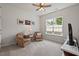 Comfortable bedroom with a window and ceiling fan providing natural light and ventilation at 524 Clarenbridge Dr, Cary, NC 27519