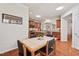 Open concept dining room with view into the kitchen featuring wood floors and recessed lighting at 524 Clarenbridge Dr, Cary, NC 27519
