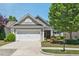 Charming single-story home with a well-manicured lawn and a two-car garage at 524 Clarenbridge Dr, Cary, NC 27519