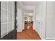 Bright foyer featuring hardwood floors, neutral walls, and a view into the living area at 524 Clarenbridge Dr, Cary, NC 27519