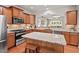 Stylish kitchen featuring stainless steel appliances, granite countertops, and wooden cabinetry at 524 Clarenbridge Dr, Cary, NC 27519