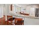 Open concept kitchen and breakfast bar with granite countertops and stainless steel appliances at 524 Clarenbridge Dr, Cary, NC 27519