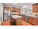 Modern kitchen featuring stainless steel appliances, granite countertops, and a kitchen island at 524 Clarenbridge Dr, Cary, NC 27519