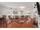Spacious living room with hardwood floors, fireplace, and a large area rug at 524 Clarenbridge Dr, Cary, NC 27519