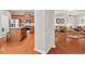 Open-concept living area showcasing hardwood floors connecting to the kitchen and living room at 524 Clarenbridge Dr, Cary, NC 27519
