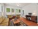 Bright living room with ample natural light, hardwood floors, and modern furnishings create a cozy atmosphere at 524 Clarenbridge Dr, Cary, NC 27519
