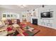 Living room featuring hardwood floors, fireplace, and access to several other rooms at 524 Clarenbridge Dr, Cary, NC 27519