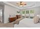 Bright and airy bedroom with tray ceilings, neutral walls, and a view of the backyard at 524 Clarenbridge Dr, Cary, NC 27519