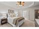 Comfortable bedroom featuring a trey ceiling, neutral decor, and access to an ensuite bathroom and closet at 524 Clarenbridge Dr, Cary, NC 27519