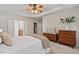 Bright bedroom with tray ceilings, neutral walls, and walk-in closet and ensuite bath at 524 Clarenbridge Dr, Cary, NC 27519