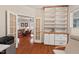 Office with built-in shelves, cabinets, and french doors leading to living space, great for privacy at 524 Clarenbridge Dr, Cary, NC 27519