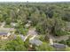 Aerial view of a residential area, showcasing tree-lined streets and well-kept homes at 5529 Shadowbrook Dr, Raleigh, NC 27612