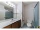 Bathroom with a large vanity, wood cabinets, and a shower-tub combination at 5529 Shadowbrook Dr, Raleigh, NC 27612