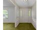 Traditional foyer featuring wallpaper, stained-glass sidelights, chandelier, and classic millwork at 5529 Shadowbrook Dr, Raleigh, NC 27612