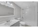 This is a bathroom featuring a bathtub and shower combination, mirror and vanity at 5602 Falls Of Neuse Rd # E, Raleigh, NC 27609