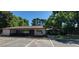 Attractive single-story condominium building with lush landscaping and ample parking in a picturesque setting at 5602 Falls Of Neuse Rd # E, Raleigh, NC 27609