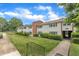 Attractive townhouse complex with well-manicured lawns and mature trees at 5602 Falls Of Neuse Rd # E, Raleigh, NC 27609