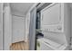 Conveniently located laundry area with stackable washer and dryer near hallway closet at 5602 Falls Of Neuse Rd # E, Raleigh, NC 27609