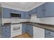 Well-maintained kitchen with modern appliances, ample countertop and cabinet space at 5602 Falls Of Neuse Rd # E, Raleigh, NC 27609