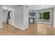 Inviting living room with hardwood floors leads to a modern kitchen and sliding doors at 5602 Falls Of Neuse Rd # E, Raleigh, NC 27609