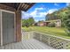 This is a outdoor patio featuring an open door, wooden deck, and grassy yard at 5602 Falls Of Neuse Rd # E, Raleigh, NC 27609