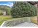 This is a outdoor patio featuring an open door, wooden deck, and grassy yard at 5602 Falls Of Neuse Rd # E, Raleigh, NC 27609