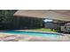 Community pool perfect for relaxation, with a clear blue swimming pool surrounded by lush greenery and lounge chairs at 5602 Falls Of Neuse Rd # E, Raleigh, NC 27609