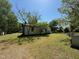 Exterior rear view of a home with white siding and a generous green lawn at 5644B Old Roxboro Rd, Oxford, NC 27565
