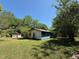 Exterior view of a home with blue siding, green lawn, and mature trees at 5644B Old Roxboro Rd, Oxford, NC 27565