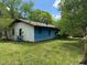 View of a home with blue siding, white trim, and a lush green lawn at 5644B Old Roxboro Rd, Oxford, NC 27565