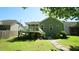 Large backyard with a deck, patio, and landscaping provides ample outdoor living space at 65 Wood Green Dr, Wendell, NC 27591