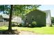 Backyard showing the home's exterior with a wooden deck, stone pathway, and green lawn at 65 Wood Green Dr, Wendell, NC 27591