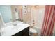 Well-lit bathroom featuring a vanity with sink, toilet, and bathtub with shower at 65 Wood Green Dr, Wendell, NC 27591