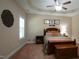 Cozy bedroom with a ceiling fan, stylish decor, and comfortable furnishings at 65 Wood Green Dr, Wendell, NC 27591
