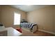 Comfortable bedroom with natural light, a single bed, and a built-in desk at 65 Wood Green Dr, Wendell, NC 27591
