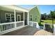 Spacious wood deck provides access to a screened-in porch and the landscaped backyard at 65 Wood Green Dr, Wendell, NC 27591