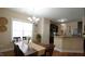 Charming dining room with natural light and a view into the kitchen at 65 Wood Green Dr, Wendell, NC 27591