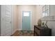 Inviting entryway featuring a stylish rug, décor, and a glimpse of natural light at 65 Wood Green Dr, Wendell, NC 27591