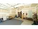 Spacious garage with ample storage space, shelving, and a blue door at 65 Wood Green Dr, Wendell, NC 27591
