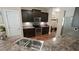 Well-equipped kitchen with dark cabinetry and stainless steel appliances at 65 Wood Green Dr, Wendell, NC 27591